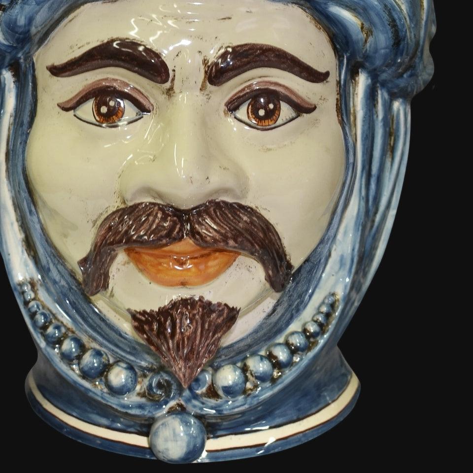 Ceramica di Caltagirone fatta a mano con volto barbuto e decori blu